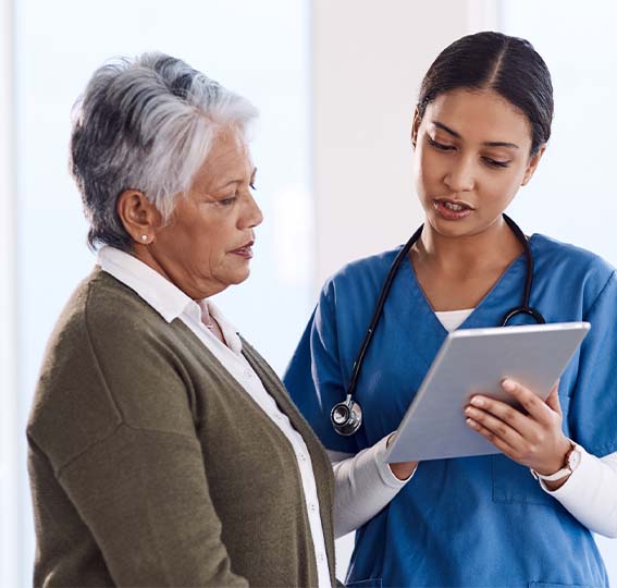 A doctor and patient looking at a medical chart.
