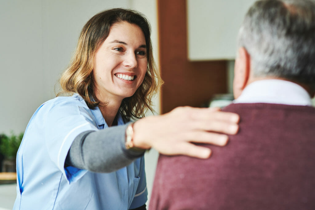 An elderly man at an appointment with a senior care doctor for the purpose of preventative health.