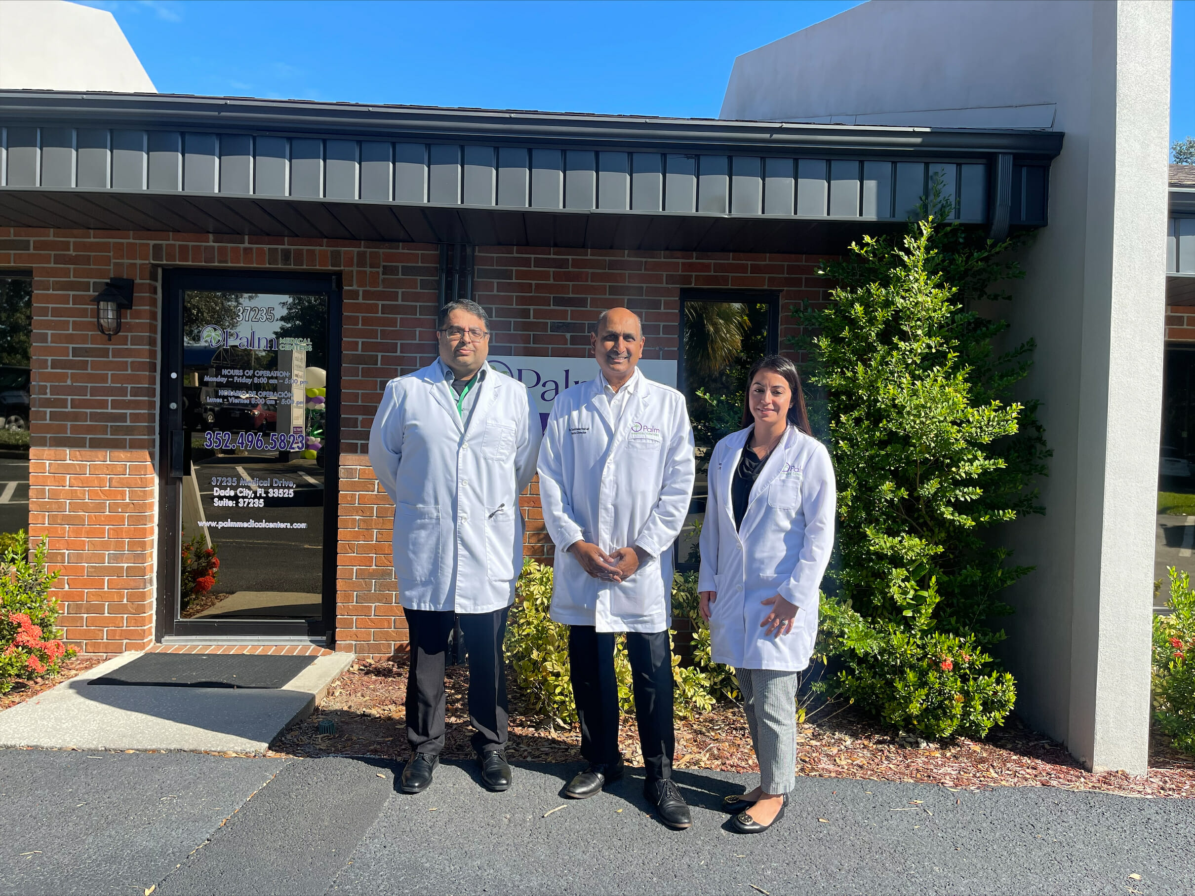 Palm Medical Center Dade City doctors smiling together.