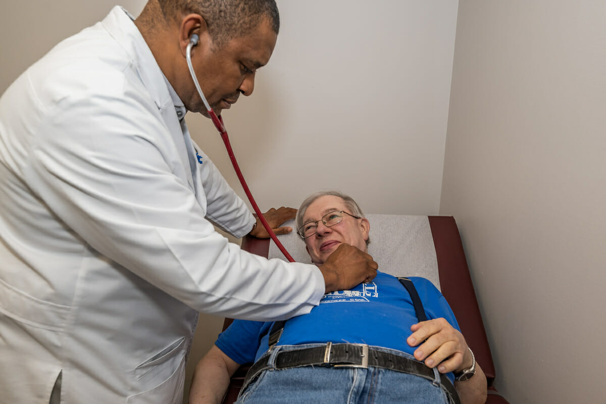 Doctor examining an elderly patient.
