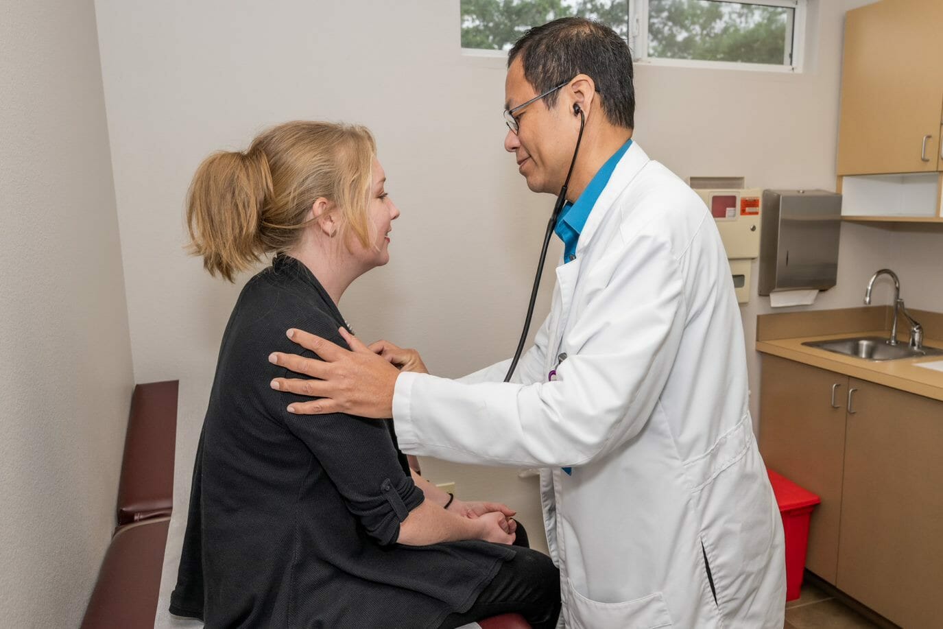 Doctor examining his patient.