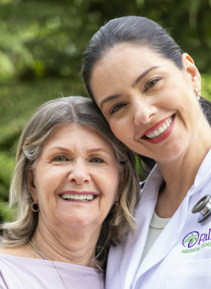 An older mother and her adult daughter.
