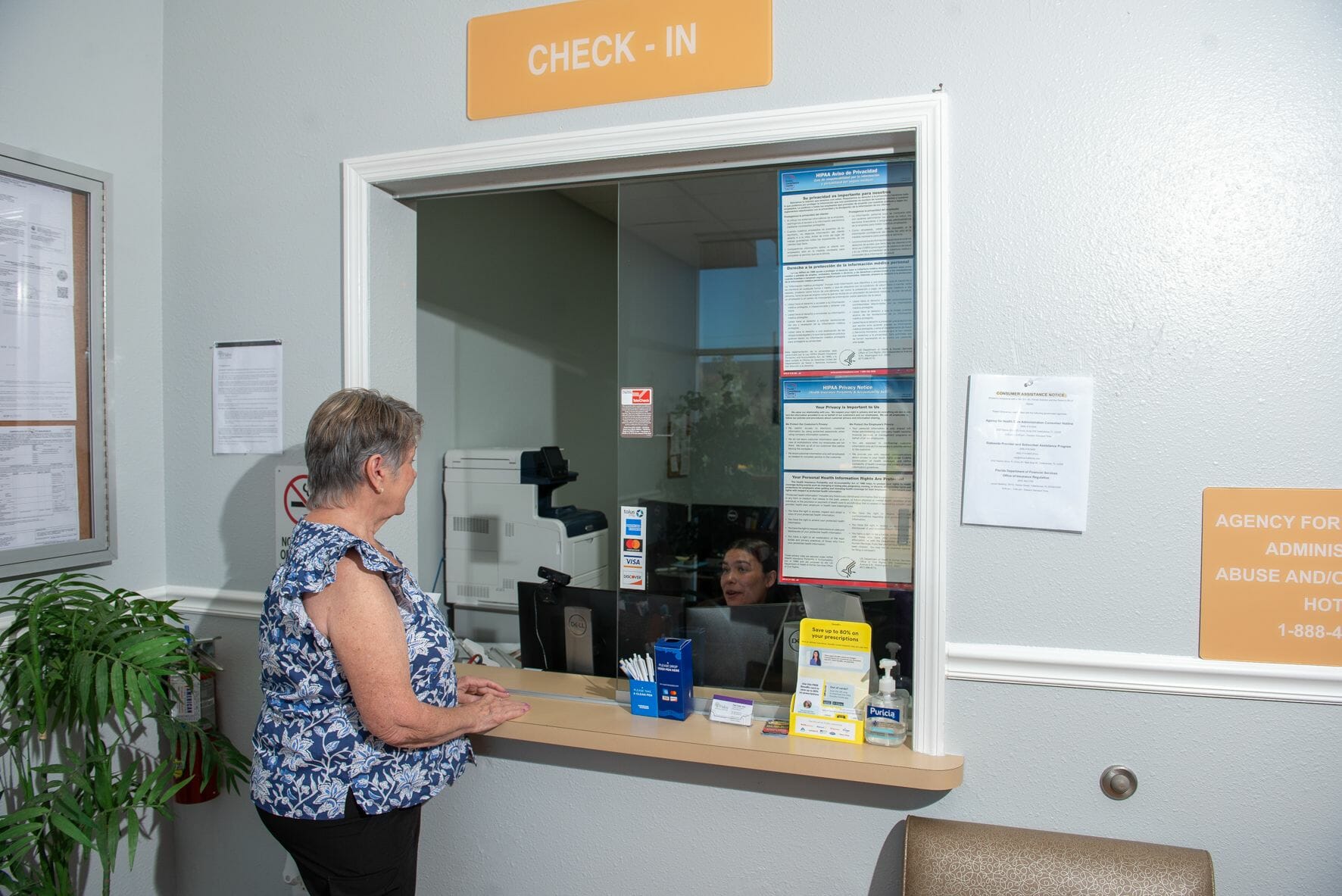 A patient checking in for her doctor appointment.