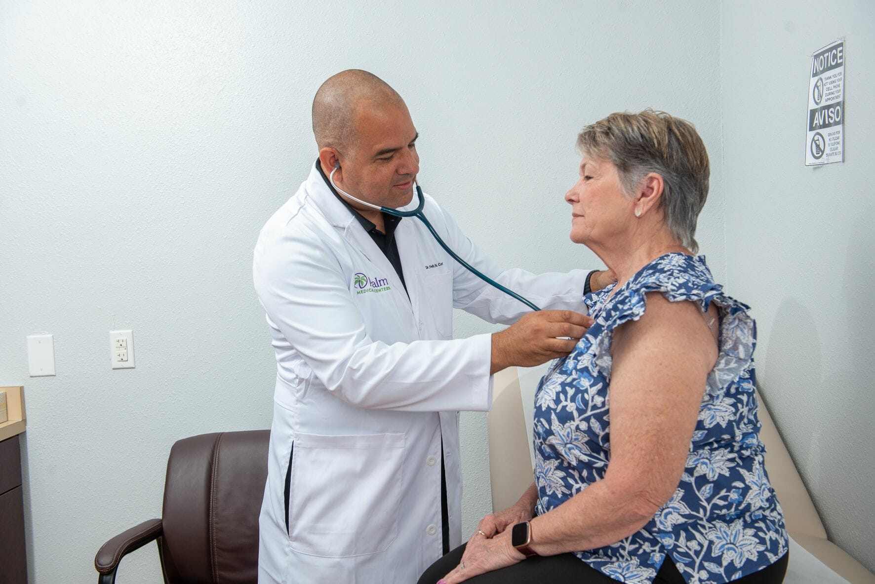 A Palm Medical Centers doctor examining his patient.