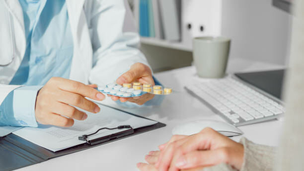 Close up of Young Asian woman doctors talking about medicine with the patient medical in health clinic. Medical health care concept.