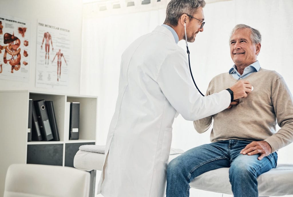 Doctor examining senior patient